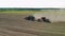Aerial sowing of crops by tractor with combined unit in dry weather