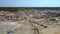 Aerial space landscape of abandoned clay pit under blue sky