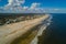 Aerial St Augustine Beach FL USA Atlantic Ocean horizon with blue sky and clouds