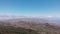 Aerial static view - valley and distant mountains, clouds and ocean, Tenerife, Spain