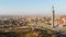 Aerial static wide Yerevan city center panorama view from cascade complex on sunrise in summer hazy morning