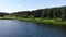 Aerial stock footage of beautiful lake located in forest in summer Sunny day