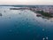 Aerial. Stone town, Zanzibar, Tanzania. Flock of Show Ships near the Zanzibar Coastline in Stone Town on Blue