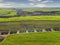 Aerial sugarcane field in Brazil. Tractor working, agribusiness