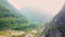 Aerial of sunny landscape of mountains, abandoned marble quarry, Carrara, Italy