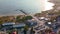 Aerial sunny view on coast with wooden pier. Sunset on Hel peninsula at Puck Bay on Baltic Sea.