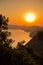 Aerial sunrise behind Alonisos island from the top of a hill in Skopelos