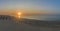 Aerial sunrise panoramic view of ilha do Farol lighthouse island, Algarve, Portugal.