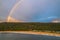 Aerial sunrise shorescape with rainbow
