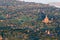 Aerial sunrise view flying over the temple and pagoda field at Bagan, Myanmar as seen from a hot air balloon flight