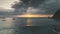 Aerial sunset above swimming people, sailing boats at sea bay. Sailboat at sunlight ocean reflection