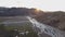 Aerial sunset over river delta in Iceland volcanic mountains