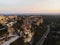 Aerial sunset panorama of medieval historic rock castle town Les Baux-de-Provence in Provence Alpes Cote dAzur France