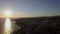 Aerial sunset scene of sea and coastline with houses in Trikorfo Beach, Greece