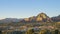 Aerial sunset view of the Capitol Butte mountain and Sedona\'s cityscape