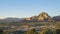 Aerial sunset view of the Capitol Butte mountain and Sedona`s cityscape from Sedona Airport Scenic Lookout at Arizona, United Stat