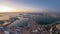 Aerial sunset view of Palm Jumeirah Island day to night timelapse.