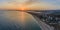 Aerial sunset view of Praia dos Tres Irmaos Three Brothers beach in Alvor, tourist destination in Algarve Coast, Portugal