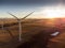 Aerial sunset view of working windmills producing sustainable energy near Pincher Creek Alberta