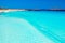 Aerial of surfer waiting for a wave in beautiful turquoise crystal clear water in Western Australia