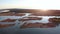 Aerial swamp on the river Lielupe in Varnukrogs - Golden Hour sunset top view from above - Drone shot with evergreen