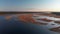 Aerial swamp on the river Lielupe in Varnukrogs - Golden Hour sunset top view from above - Drone shot with evergreen