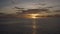 Aerial sweeping shot of a sunset over the ocean at Grand Turk in Caribbean