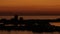 Aerial sweeping video orange sunset silhouette Sarasota Florida