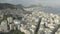 Aerial, sweeping view of favelas on the hills of Rio de Janeiro