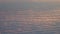 Aerial tilt shot above sun lit dense clouds at sunset. 4K video