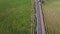 Aerial tilt up above a street near grazing farms at Pomaire, Chile