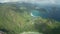 Aerial tilt up and lift up over bay Ternay overlooking northwest coast