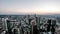 Aerial time lapse of the Frankfurt / Main skyline and site of a skyscraper during sunset on a hot summer day - Germany