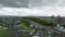 Aerial timelapse: Grey storm clouds move over bullet train tracks