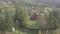 Aerial to old wooden Orthodox church in mountain village Kryvorivnia in Ukrainian Carpathians mountains
