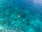 Aerial top down people snorkeling on coral reef tropical caribbean sea, turquoise blue water. Indonesia Wakatobi archipelago,