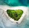 Aerial top down photo of a beautiful small beach island with white sand