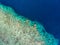 Aerial top down view coral reef tropical caribbean sea, turquoise blue water. Indonesia Moluccas archipelago, Banda Islands, Pulau