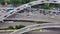 Aerial top down view of highway interchange junction road with traffic. Shot with camera rotation