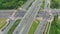 Aerial top down view of interchange road junction traffic. Drone shot flying