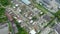 Aerial top down view of mining vehicle parking lot located at a steel making production plant showing dusty and dirty parked haul