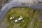 Aerial top down view on old lighthouse of Inisheer, Aran island, county Galway, Ireland. Irish landscape with rough stone coast