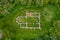 Aerial top down view about Schlossberg church ruins surrounded by forest.