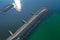 Aerial top down view on sea breakwaters and ship port entrance