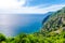 Aerial top panoramic view of green hills, rocks, cliffs and Gulf of Genoa, Ligurian Sea, coastline of Riviera di Levante, National