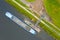 Aerial top shot from freighter unloading sand in the countryside from Netherlands