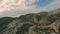 Aerial top view of accurate serpentine narrow road. A road full of twists and turns in Eastern Turkey, Hasankeyf. Aerial