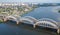 Aerial top view of automobile and railroad Darnitsky bridge across Dnieper river from above, Kiev Kyiv city, Ukraine