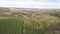 Aerial top view, Autumn landscape of wild forest. Clip. High angle view of a road trough the autumn forest