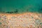 Aerial top view on the beach. People, umbrellas, sand and sea wa